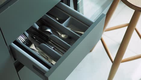 organized kitchen drawer with cutlery