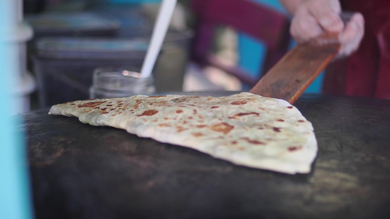 Street Food Vendor Cooking Traditional Gozleme on a Hot Griddle