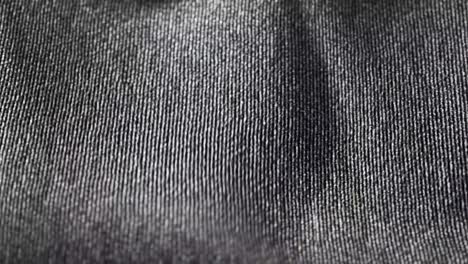 Highly-detailed-grey-cloth-fabric-fluttering-on-the-wind.-Textile-surface-with-fiber-pattern-visible-in-close-up-camera.-Natural,-smooth-drapery-movement.-Endless,-seamless,-loopable-animation.