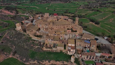 View-from-above-of-castle-and-town-Florejachs,-Lleida,-Spain