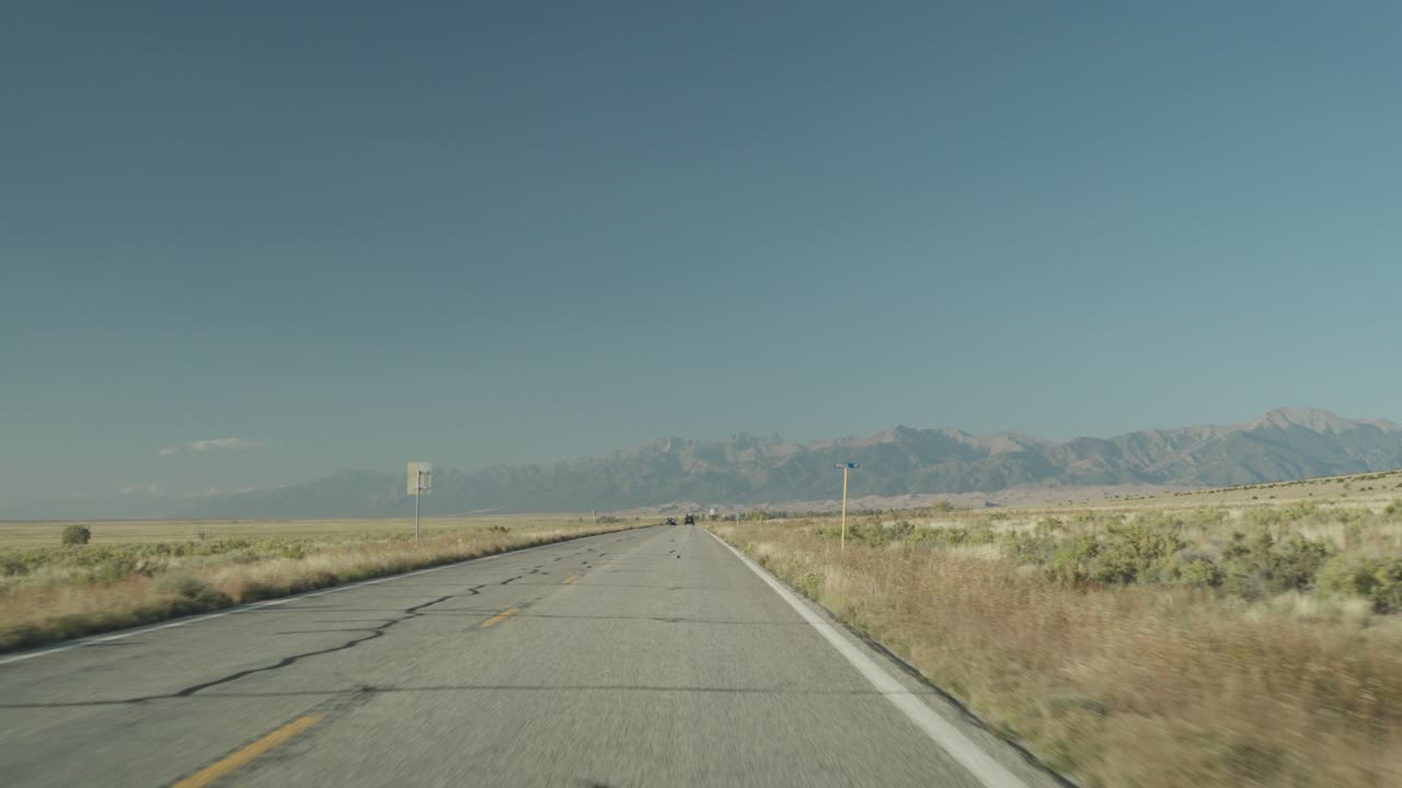 Open road landscape with mountains in the distance