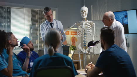 medical professionals discussing anatomy and x-rays