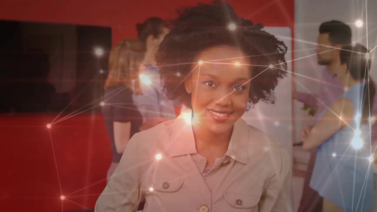 Woman tapping tablet inside tech hub, activating glowing network lines pulsing for collaboration