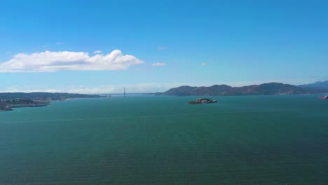 san francisco bay area, aerial panning of city coastline, alcatraz island, and golden gate bridge