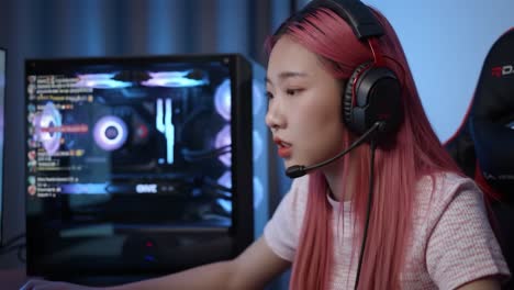 a focused gamer with pink hair engaged in competitive play, utilizing a high-performance gaming setup enhanced by rgb lighting and communication gear