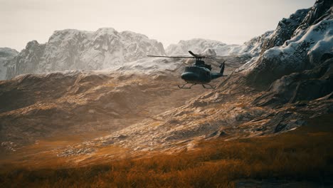 slow motion vietnam war era helicopter in mountains