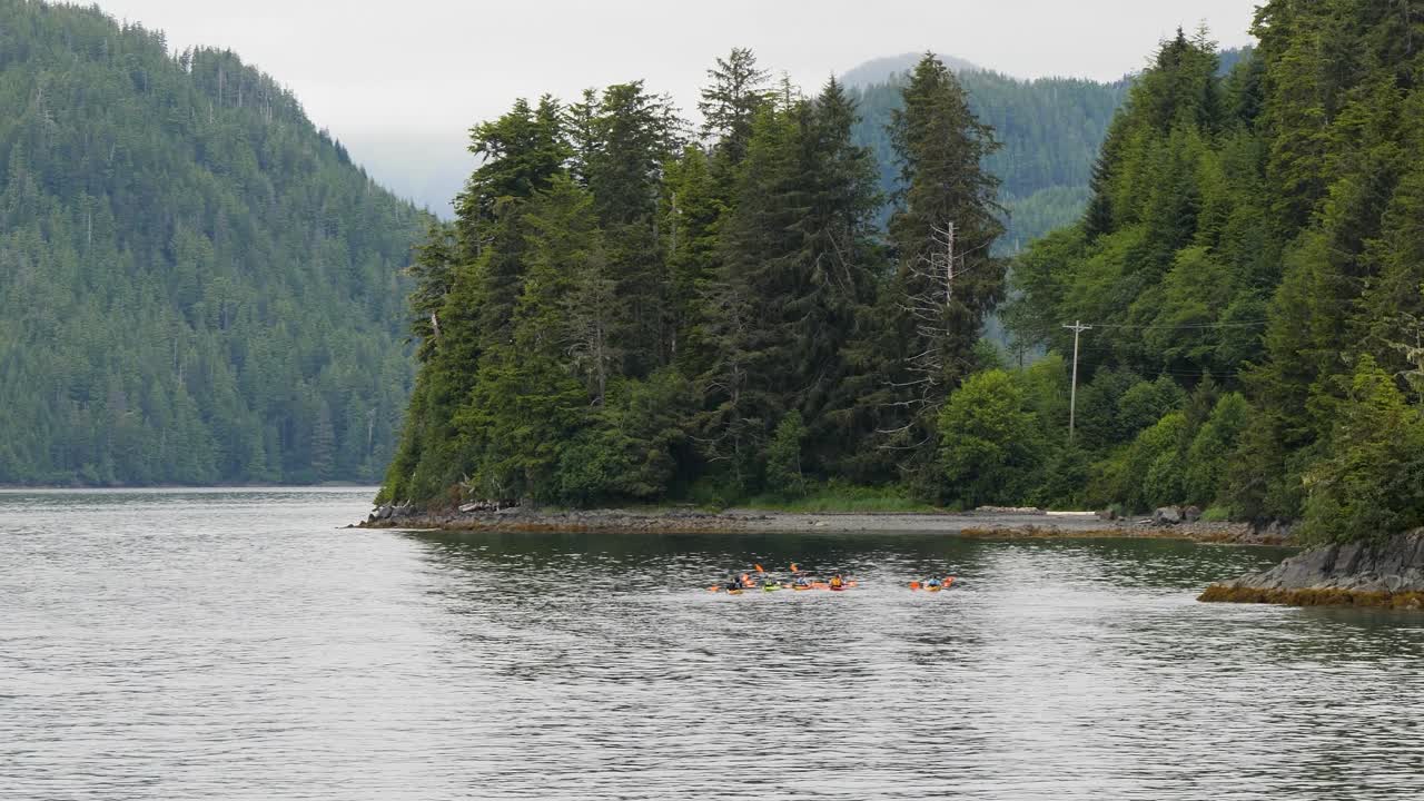 Tourists kayaking in Sitka, Alaska, United States of America.