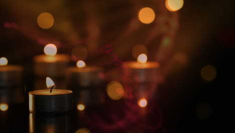 animation of tea light candles with flickering spots of light