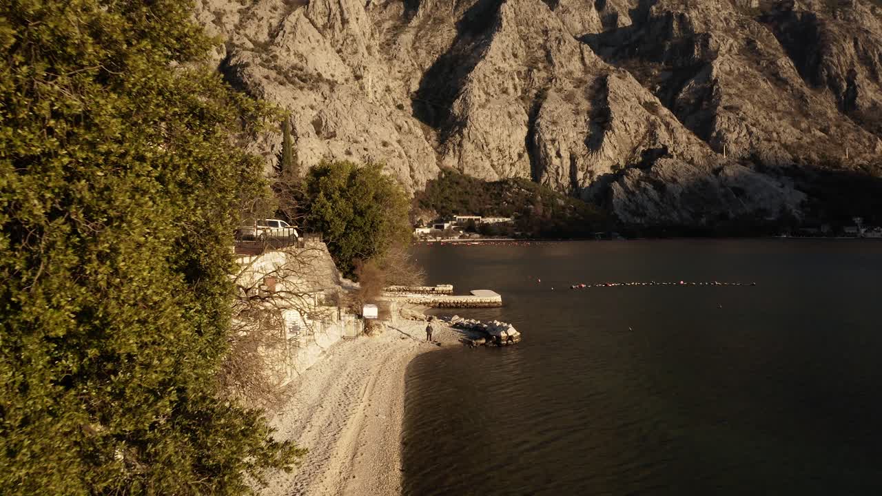 AERIAL - Bay of Kotor in the ancient city of Kotor, Montenegro, reverse rising shot