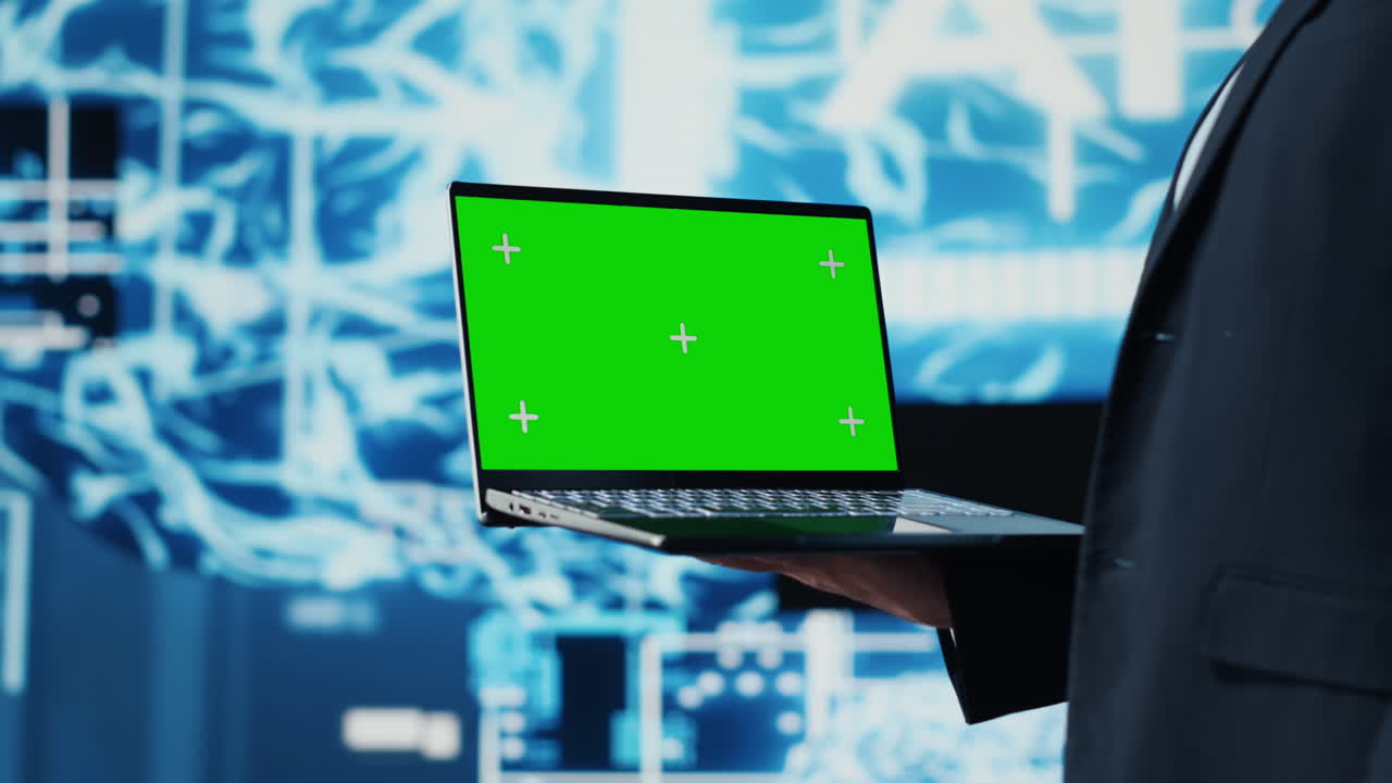 General manager holds chroma key laptop next to AI neural networks