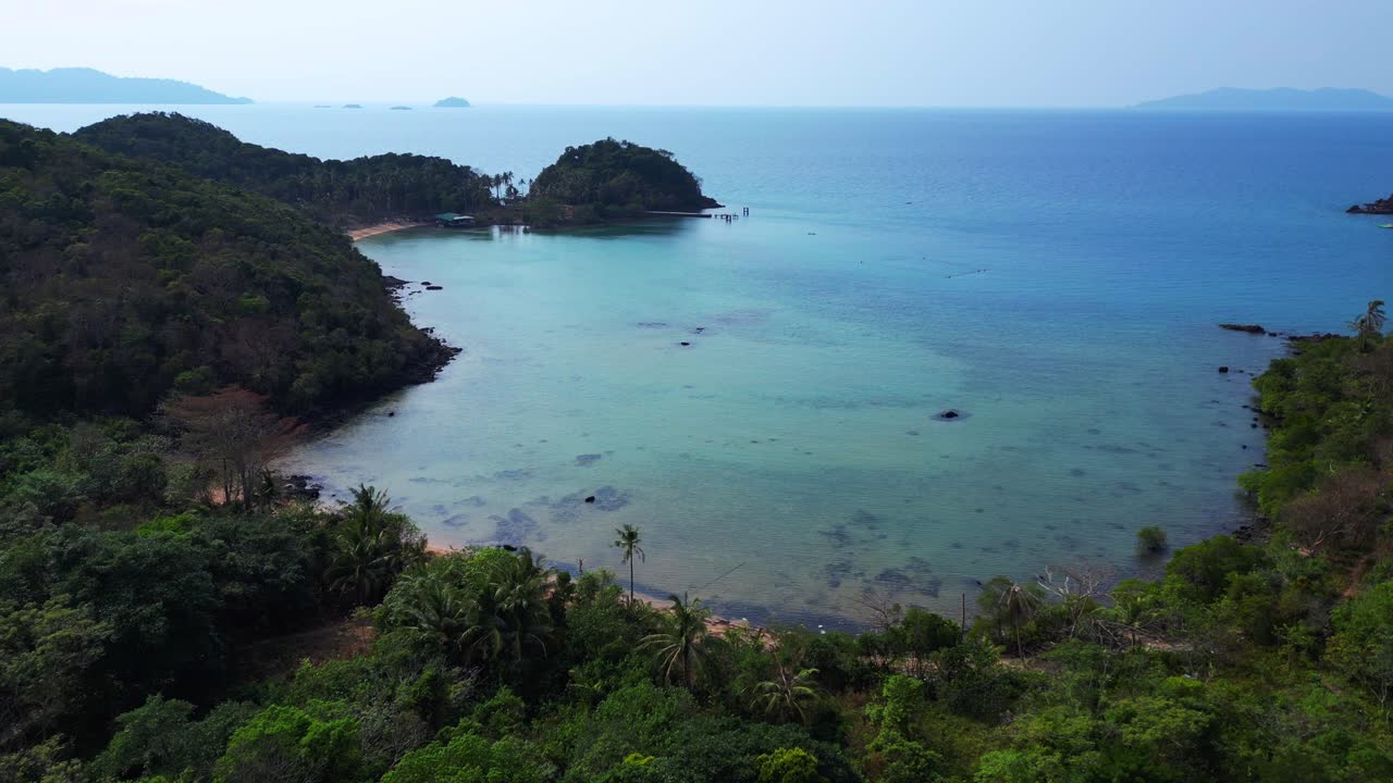 Koh Mak tropical island in Thailand showing turquoise water and green rainforest. Gorgeous aerial view flight panorama overview drone