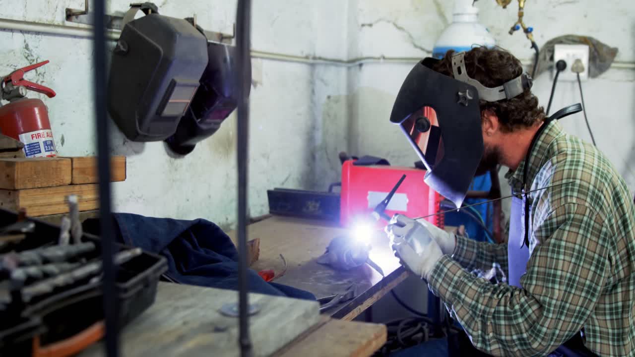 Welder working in workshop 4k