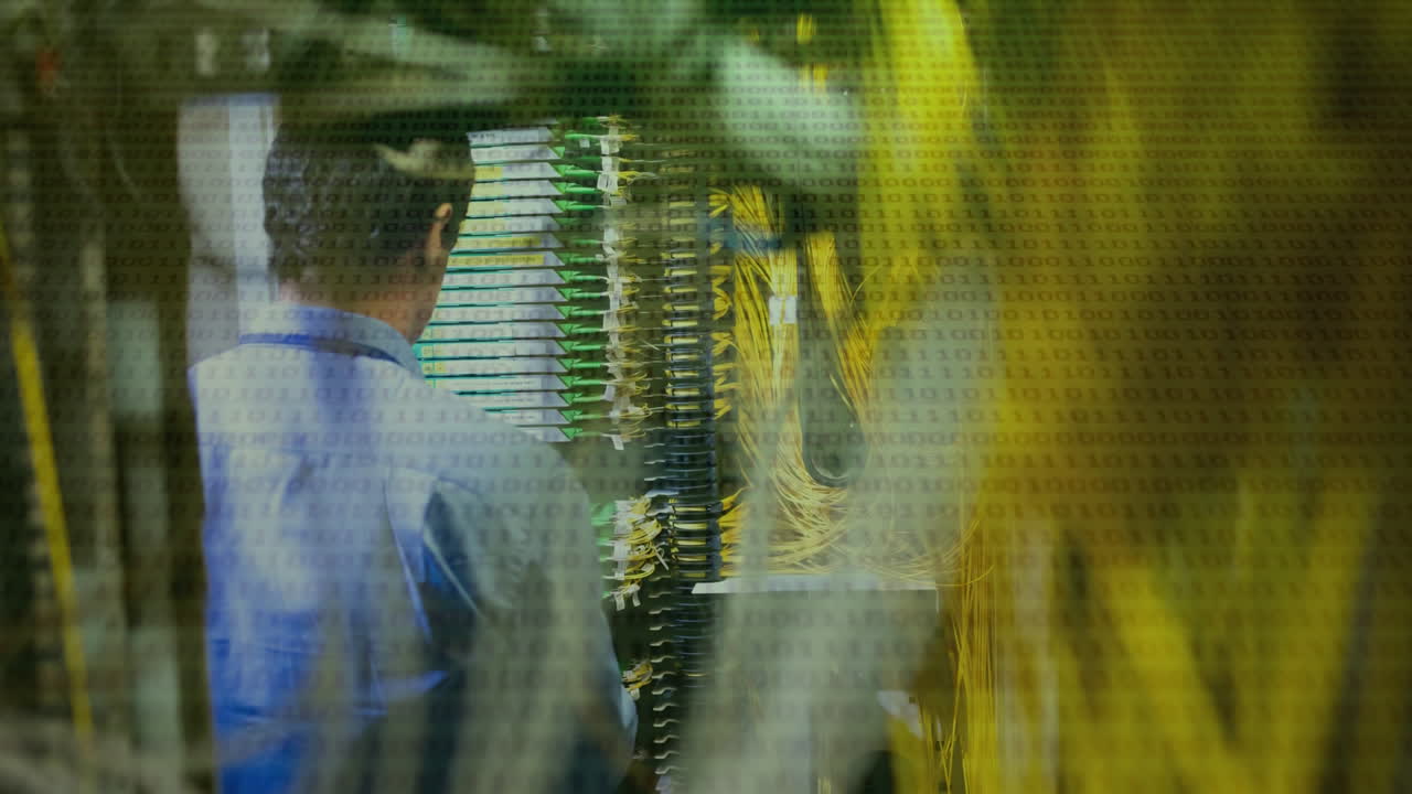 Binary code over technician working with network cables and server racks