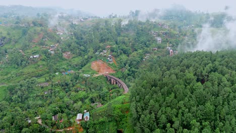 stunning aerial drone footage of the iconic nine arches bridge in ella, sri lanka.