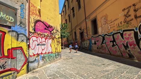 colorful graffiti with people walking in alley