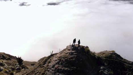 circular aerial view of couple on te mata park on a amazing cloudy landscape