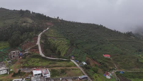 early morning mist floating over the vibrant landscape of kodaikanal hills