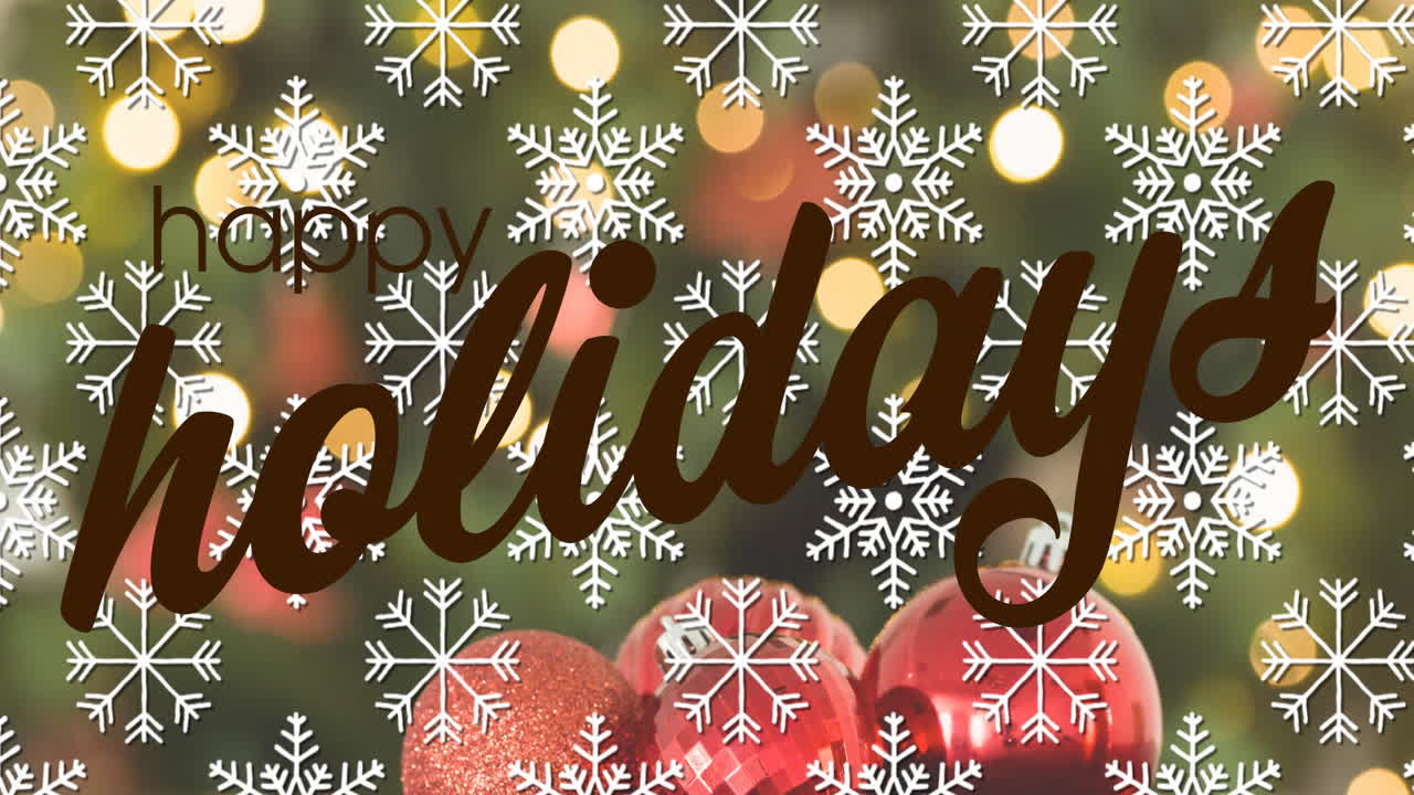 Happy holidays text animation over snowflakes and Christmas ornaments
