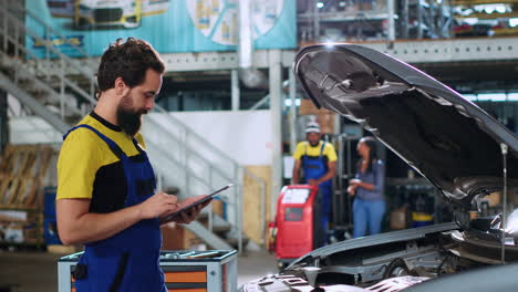 mechanic doing car routine checkup