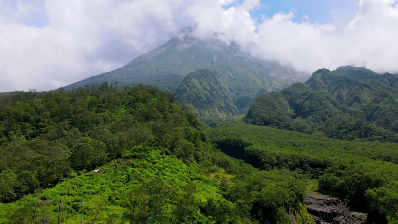 Hyperlapse drone shot of mountain in cloudy weather with forest vegetation and river valleys