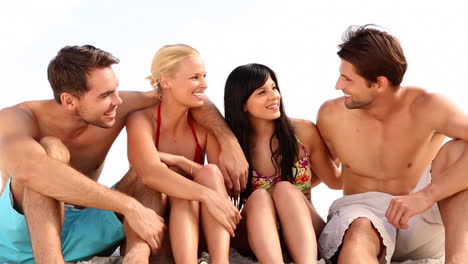 group of friends and couple chatting together