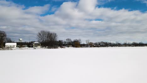 Pushing-forward-from-a-parking-lot-on-the-coast-over-Mona-Lake-in-winter