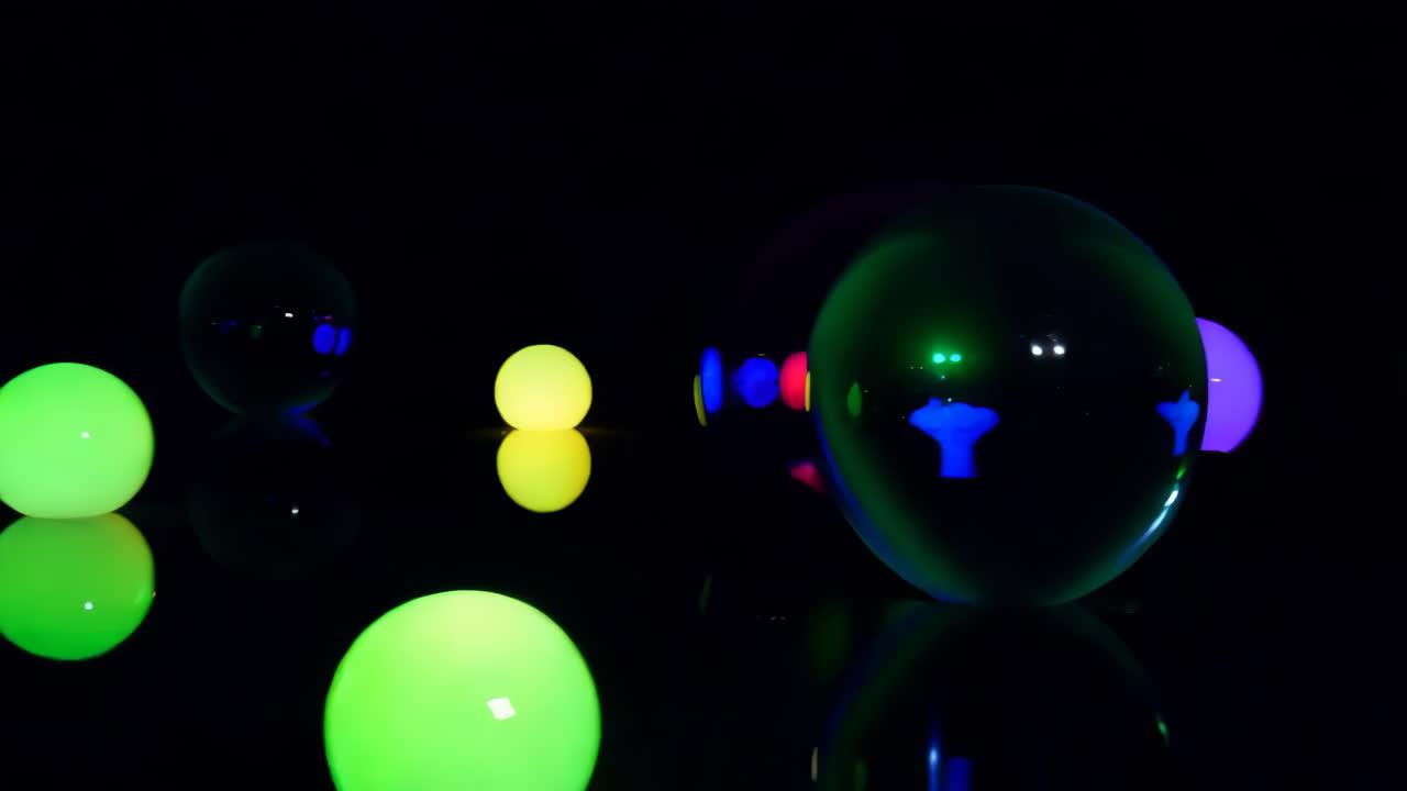 Glowing Spheres on a Dark Reflective Surface