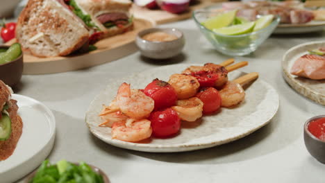 shrimp and tomato skewers with sandwiches