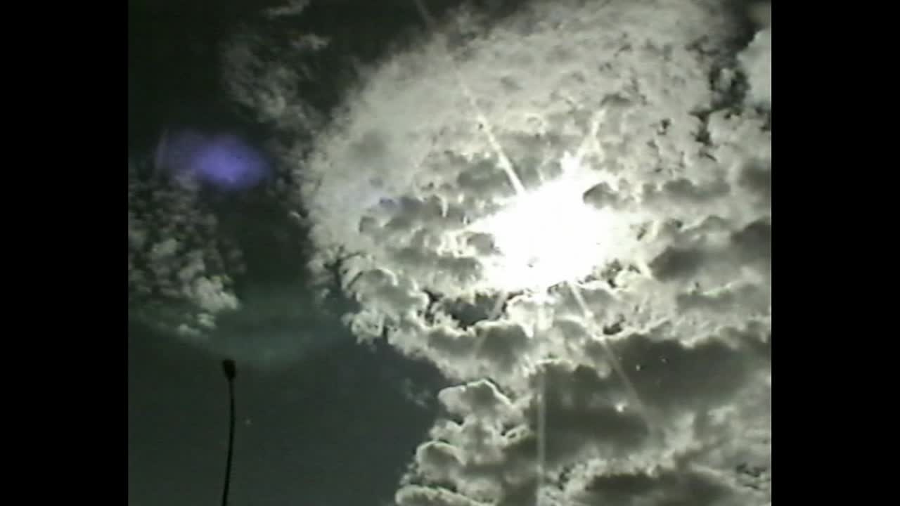 Man driving at night with retro VHS aesthetic