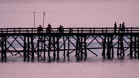 the mon bridge is an old wooden bridge located in sangkla, thailand