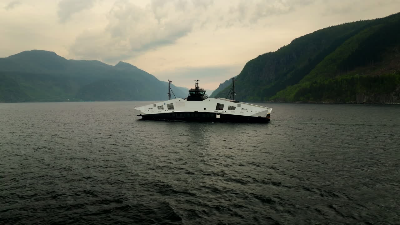 Futuristic liquid-hydrogen ferry in Hjelmeland, Norway. Side aerial tracking