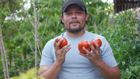 latin farmer standing in vegetable garden, local agriculture economy
