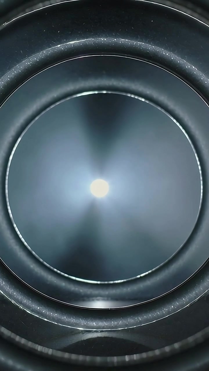 Vertical video: Revealing concentric tube ridges at inspection as LED flash appearing, cam drifting