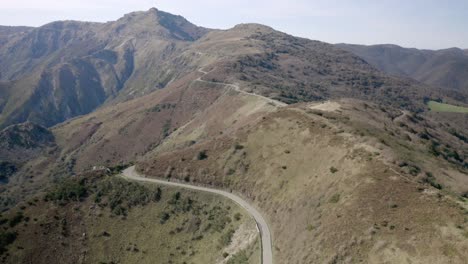 Aerial-view-of-a-road-through-some-mountains-in-Italy