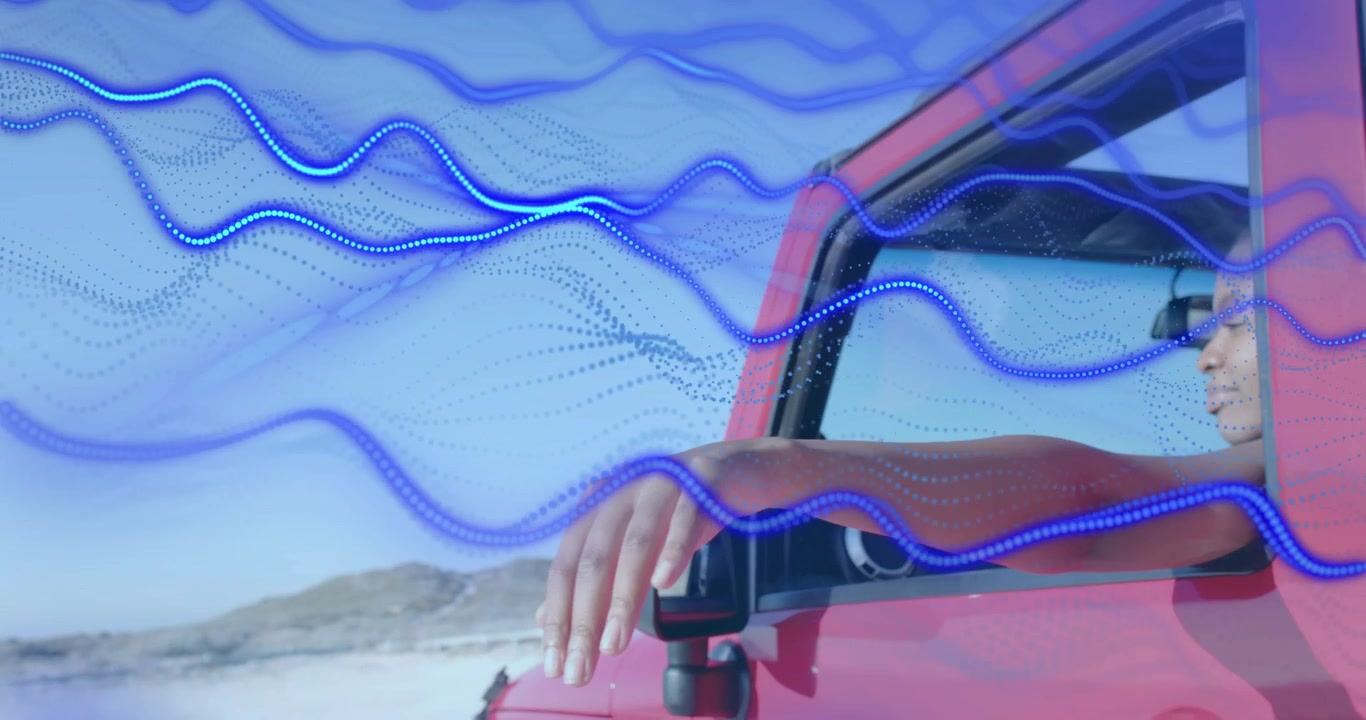 Conducente di auto che estende la mano fuori dal finestrino mentre l'auto è in crociera, mappando il flusso d'aria tramite onde animate