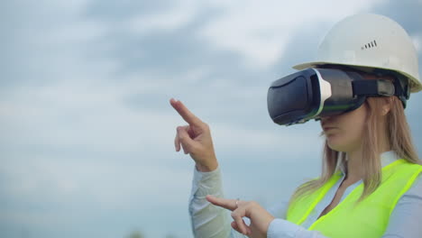 High-voltage-power-lines-controlled-by-a-female-engineer-using-virtual-reality-to-control-power.-Alternative-energy-sources-in-a-modern-city