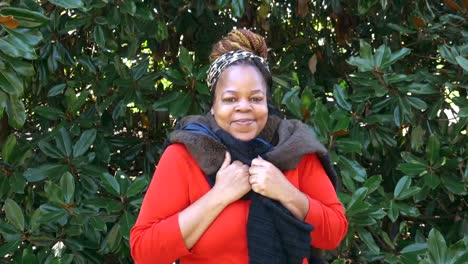 Happy-and-smiling-Black-woman-looking-directly-at-camera-with-scarf-on-Winter