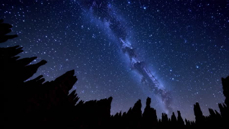 milky way over rock formations