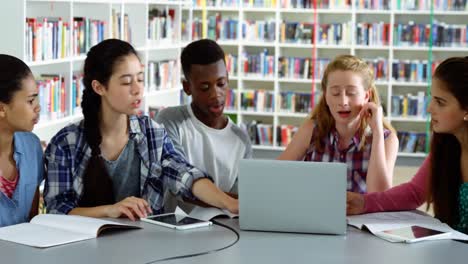 teacher using digital tablet while student studying in background 4k