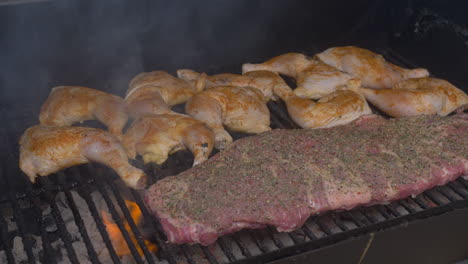 tilt down to grilling rack of bbq ribs and seasoned chicken thighs