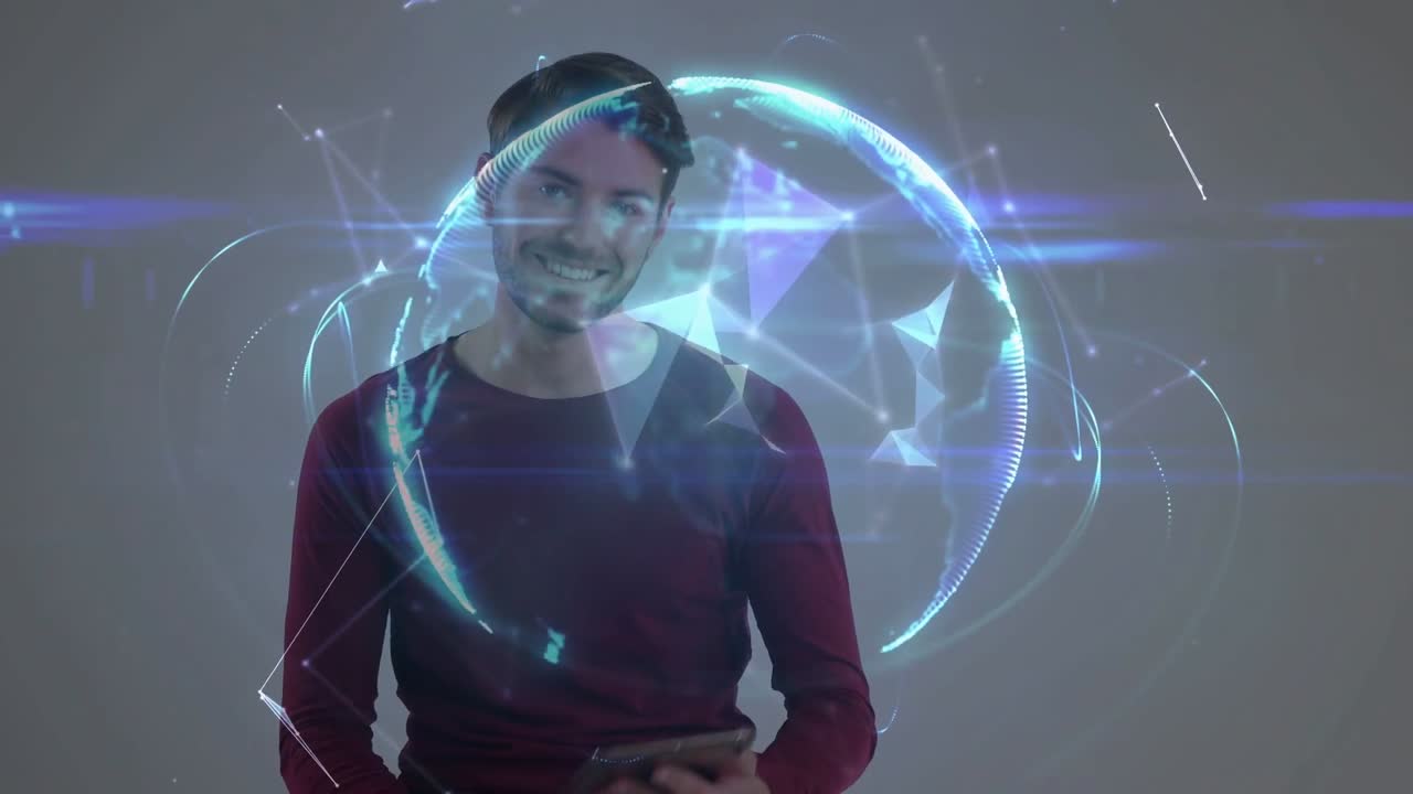 Homem tocando em tablet em estúdio iniciando rede tecnológica poligonal e mostrando um globo holográfico se formando ao redor dele.