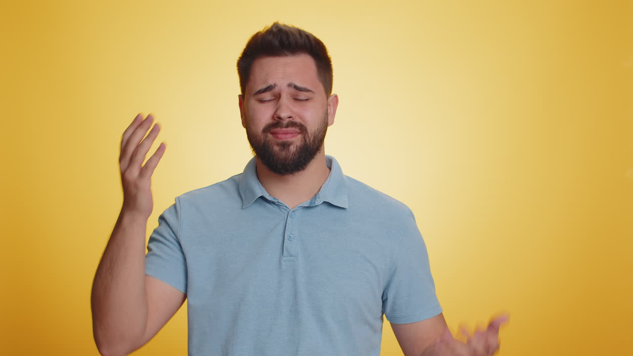 Bearded caucasian man loses becoming surprised by lottery results bad fortune loss unlucky news