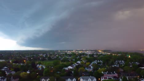 aerial view from coming storm above highway and neighborhoods of montreal, canada.