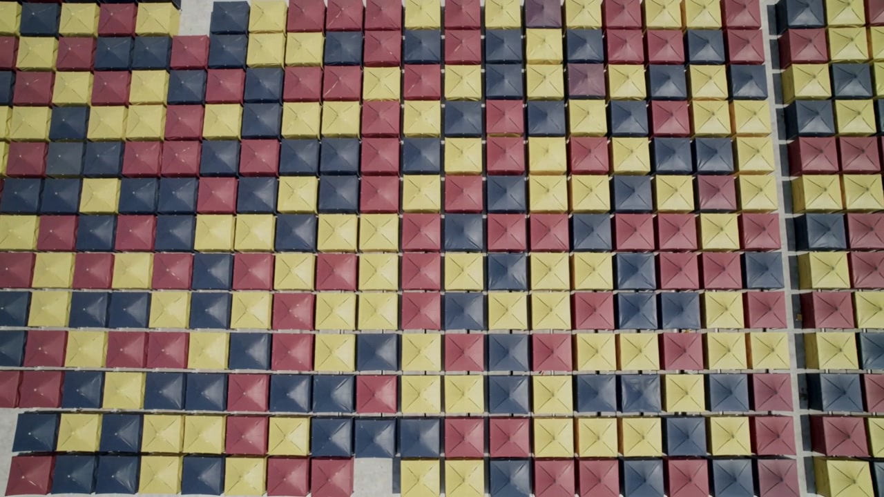 Panning camera over tri-color grid on hard floor, showing right divider and marks to reveal pattern