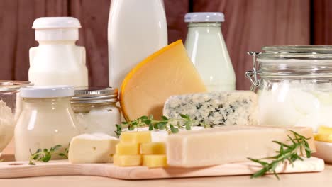 various dairy items displayed on a wooden surface