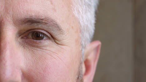 Face-closeup-of-an-older-man-with-grey-hair