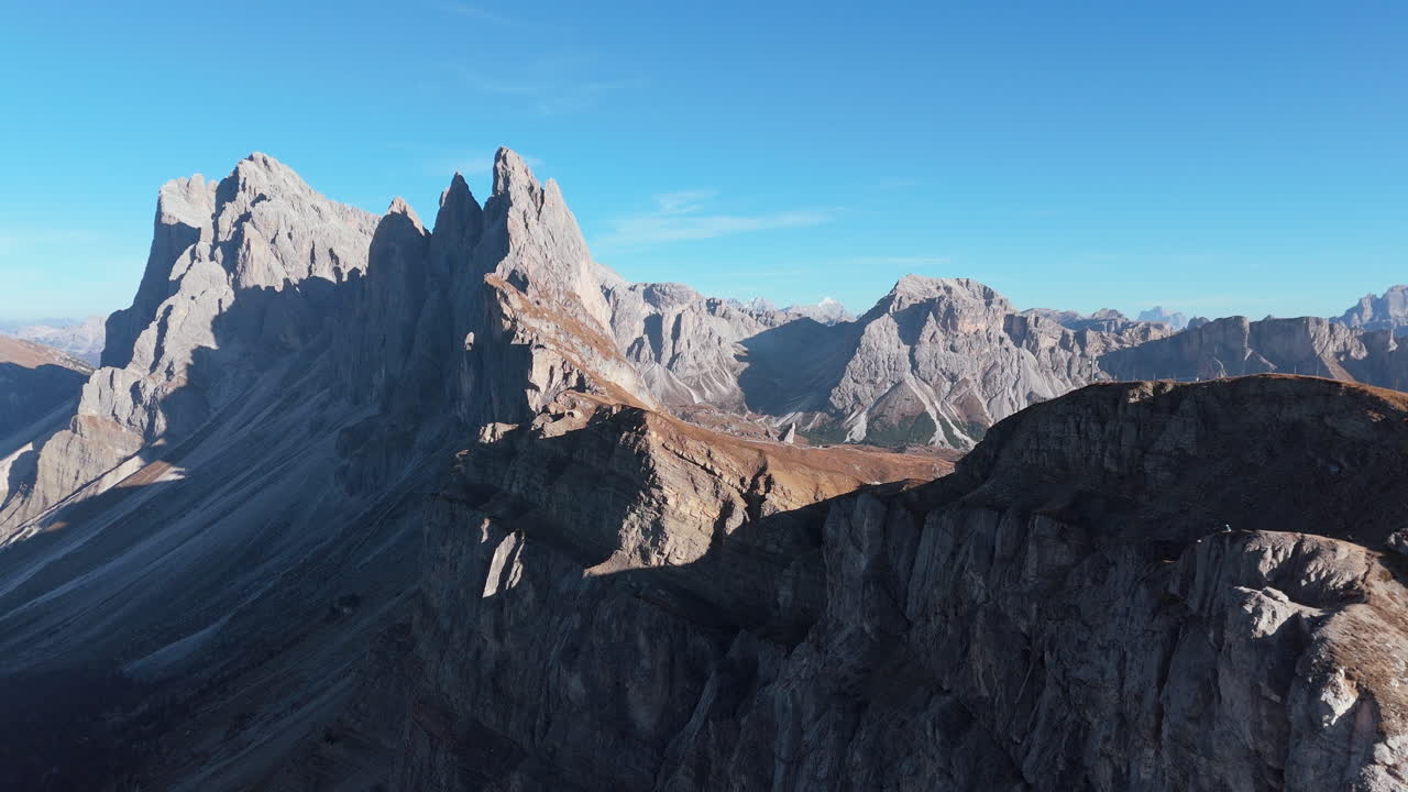 Dramatic and imposing Dolomite cliffs of Seceda Ridgeline, Puez Odle. Aerial
