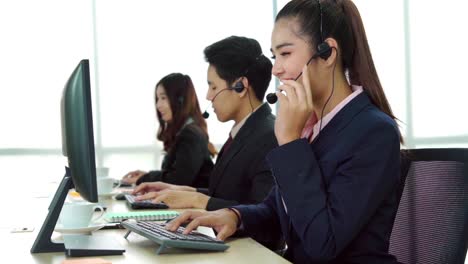 business people wearing headset working in office