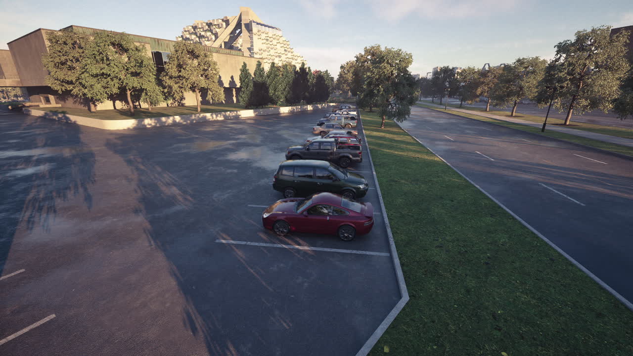 Early morning view of a parking lot lined with several parked cars