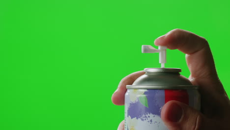 hand spraying air freshener